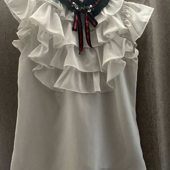 Chic White Ruffle Blouse with Black Accents - Picture 1 of 3